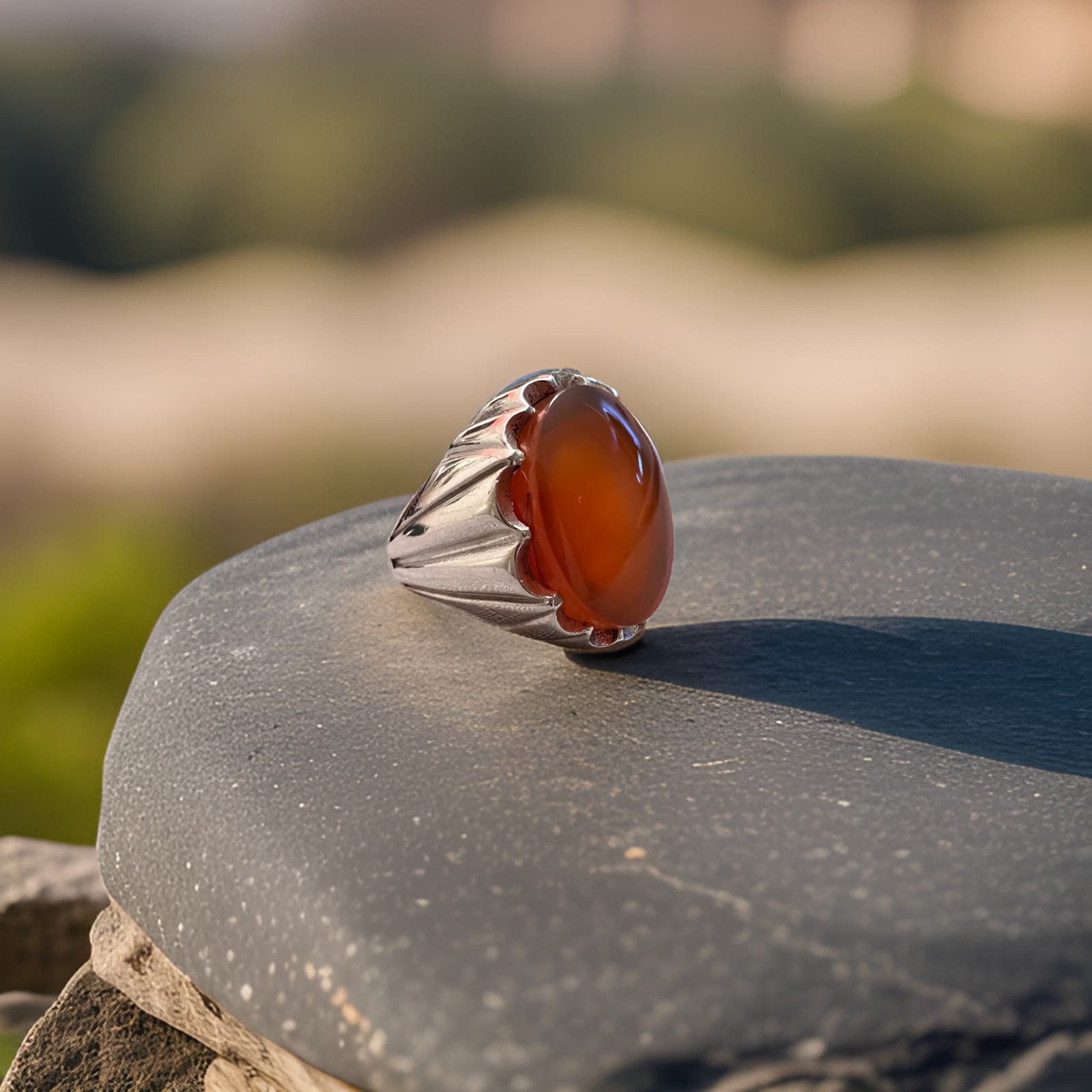 Almqam — a silver signet ring set with a carnelian aqeeq cabochon, photographed and retouched in-house